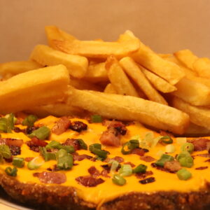 Milanesa con Cheddar, Panceta y Verdeo